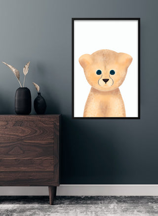 Framed poster of a cute cartoon leopard for children, displayed above a dresser in a modern kids' room.