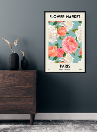 Flower Market - Paris poster featuring pink and white blossoms with green leaves, hanging on a modern wall.