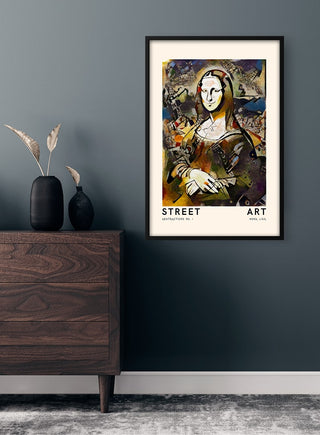 Framed Street Art - Mona Lisa poster hanging on a dark wall above a wooden dresser in a modern room.
