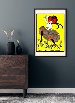 Framed Le Frou Vintage art poster with vibrant colors displayed on a dark wall above a wooden dresser.