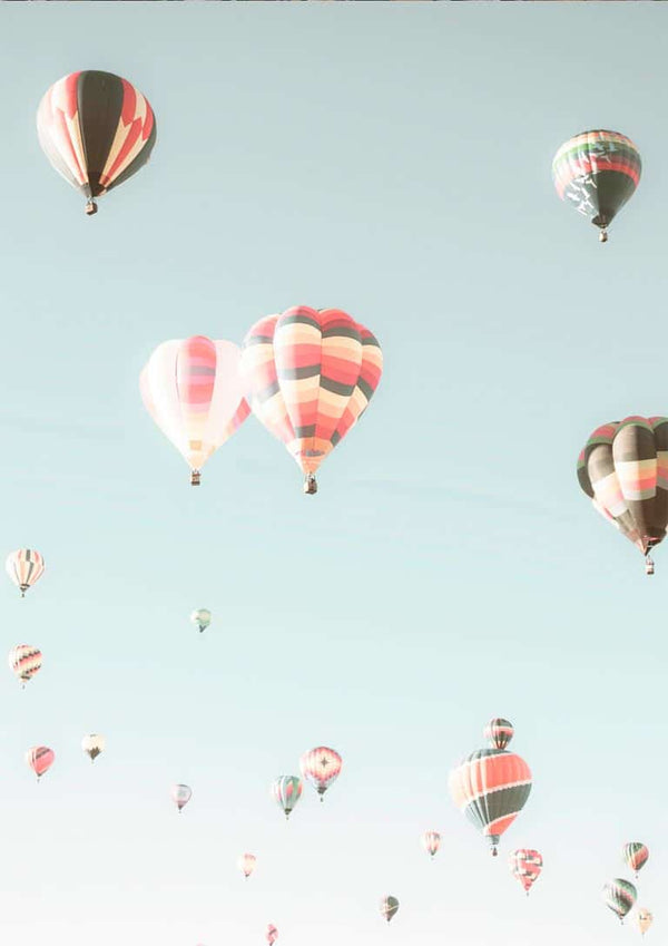 Colorful hot air balloons float against a clear blue sky, featured on the Hot Air Balloons Plakat product page.