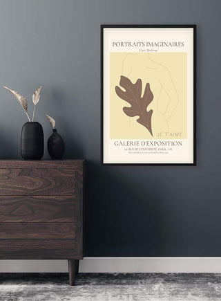 Minimalist art poster with abstract female form and leaf, titled "Portraits Imaginaires Woman No. 2" above a dresser.