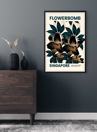 Framed Flowerbomb - Singapore Plakat floral art print on a dark wall above a modern wooden dresser with a vase.