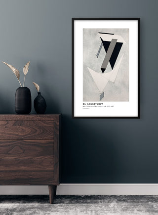 El Lissitzky - Proun Plakat print in a black frame, displayed above a dark wood dresser in a modern interior.
