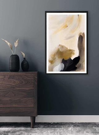 Abstract Strokes Plakat featuring beige, black, and white brushstrokes, framed on a dark wall above a wooden dresser.