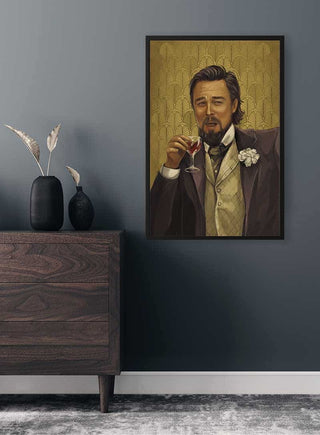 Framed Leonardo Candy Unchained Plakat on a gray wall above a wooden dresser with decorative vases.