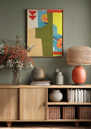 Peach & Mandarin by Kareem Rizk above a wooden sideboard on a sage green wall