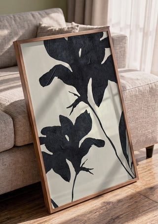 Shadowed Blooms by ThingDesign in a walnut frame leaning against a grey sofa
