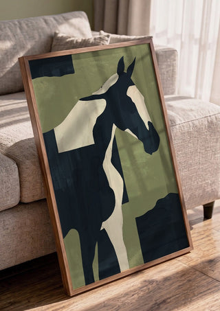 Abstract Minimal Horse 4 by ThingDesign in a walnut frame leaning against a grey sofa