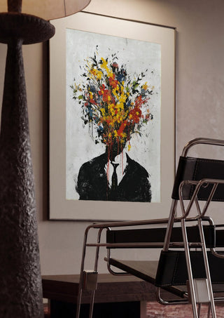 Headbloom x Banksy by Decker Studios framed in a dim room beside a tubular steel chair