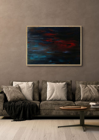 A man's frustration by PeKo in a light oak frame above a grey sofa on a warm brown wall
