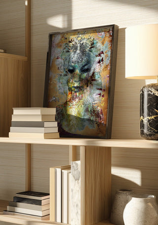 Close my eyes - So I can see by Henrik Kock in a dark frame on a wooden shelf beside books and a lamp