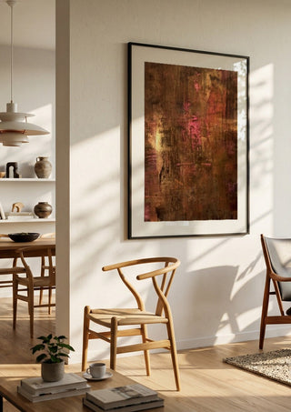 Copper and Rose by Kristof ellertz in a black frame in a bright dining room with wooden chairs