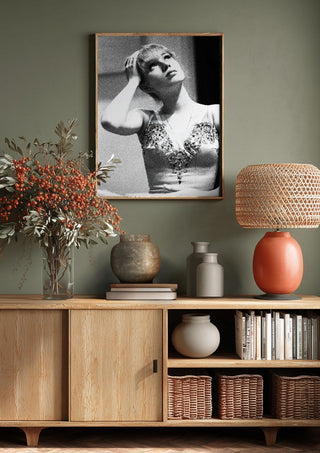 The Russian ballet dancer by Bettinafloorphoto above a wooden sideboard on a sage green wall