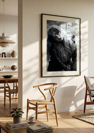 Wind in Her Hair by Bettinafloorphoto in a large black frame in a bright dining room
