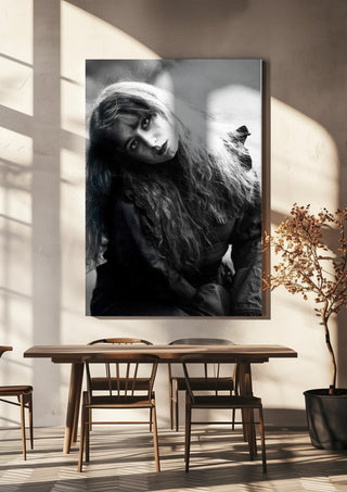 Wind in Her Hair by Bettinafloorphoto hanging above a wooden dining table in warm sunlight