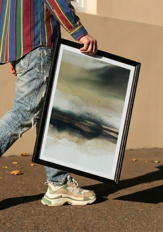 Apparent infinity by Tania Zubareva carried in a black frame along a sunny street