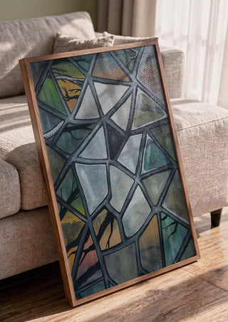 Cracked Glass by Fredprikas in a walnut frame leaning against a grey sofa