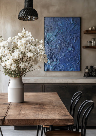 Das Meer by Sophie Schillen in a black frame above a rustic table with white flowers