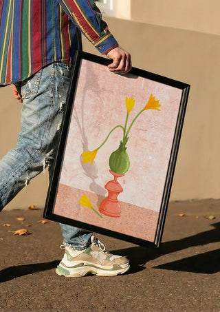 Crocus on pedestal by Creationsbyeditabrus carried in a black frame along a sunny street