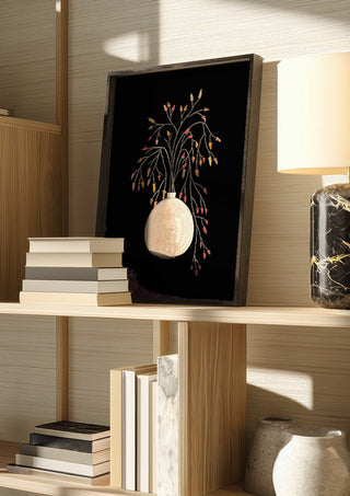Branches with berries in vase by Creationsbyeditabrus in a dark frame on a wooden shelf beside books and a lamp