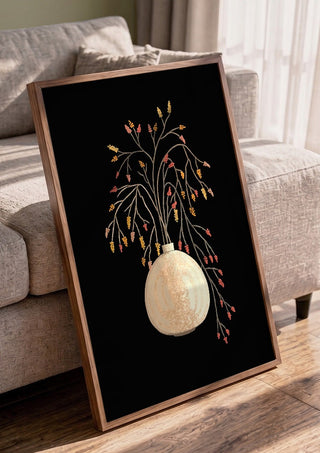 Branches with berries in vase by Creationsbyeditabrus in a walnut frame leaning against a grey sofa