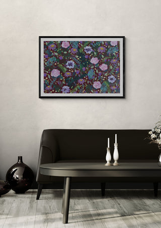 Hamble cottage by Rebecca Wright in a black frame on a pale wall above a dark sofa with candlesticks