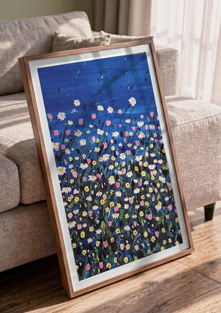 Daisies by Rebecca Wright in a walnut frame leaning against a grey sofa