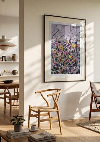 Silver street by Rebecca Wright in a black frame in a bright dining room with wooden chairs