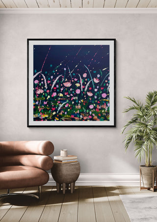Thames Rain by Rebecca Wright in a black frame on a lilac grey wall above a tan leather sofa