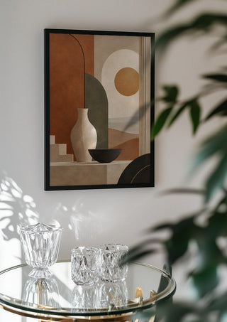 Earth Tones and Minimalist Shapes by TimlessArtworks in a black frame above a glass table with crystal glassware