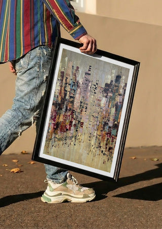 A Thousand windows by Art Anne Lee carried in a black frame along a sunny street