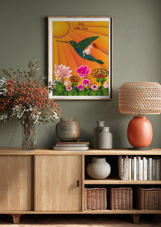 The Sun by Sciurus tarotus above a wooden sideboard on a sage green wall