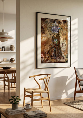 Tiden der var by Henrik Kock in a black frame in a bright dining room with wooden chairs