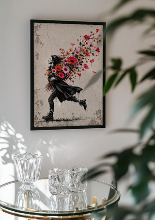 Running with Spring by Matthews Gallerie in a black frame above a glass table with crystal glassware