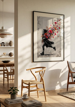 Running with Spring by Matthews Gallerie in a black frame in a bright dining room with wooden chairs