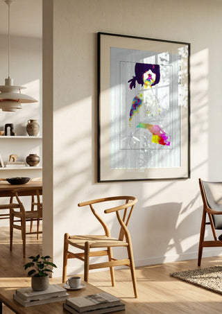 Teenage by Bent Hardervig in a black frame in a bright dining room with wooden chairs