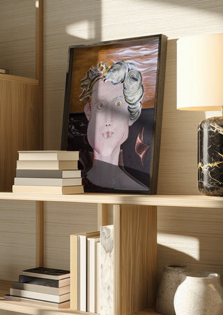 Looksmaxxer Deluxe by Emil Walli in a dark frame on a wooden shelf beside books and a lamp