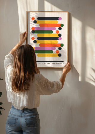 Bauhaus Stacks by Neil Stevens being hung on a sunlit wall