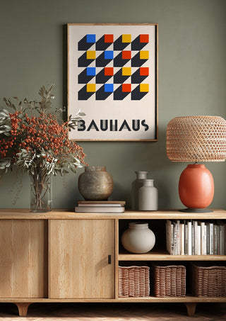 Bauhaus Grid by Neil Stevens above a wooden sideboard on a sage green wall