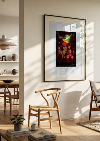 Nachtflits by Madame Petit in a black frame in a bright dining room with wooden chairs