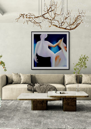Contact #3 by Luis Valquaresma in a black frame above a pale sofa under a branch chandelier