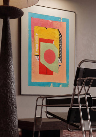 Vermilion Circle by Kareem Rizk framed in a dim room beside a tubular steel chair