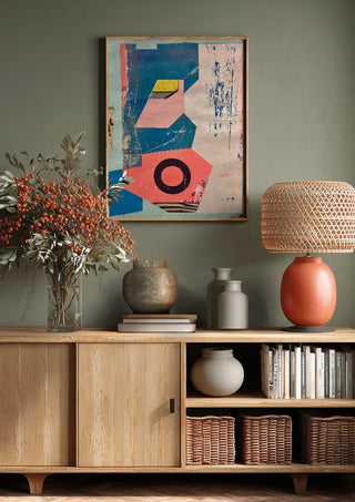 Abstract Composition No.2 by Kareem Rizk above a wooden sideboard on a sage green wall