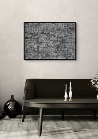 Any Point by Priit Ruttas in a black frame above a dark sofa with candlesticks