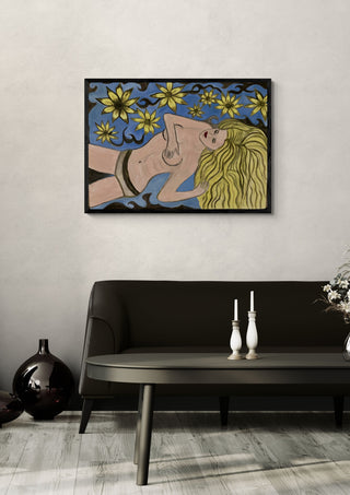 Die Blonde by Carmen Coduri in a black frame above a dark sofa with candlesticks