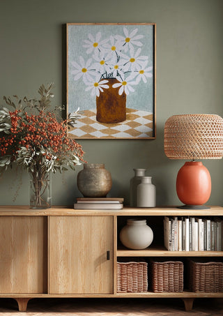 Rutig duk med brun vas by Rebecka Hansson above a wooden sideboard on a sage green wall