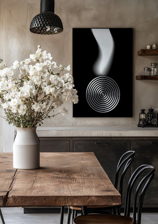 Echo by Aleksi Allan in a black frame above a rustic table with white flowers