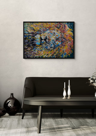 Soul of a lion by Bibi in a black frame above a dark sofa with candlesticks