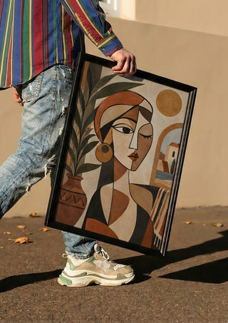 Mediterranean Cubist Woman by TimlessArtworks carried in a black frame along a sunny street